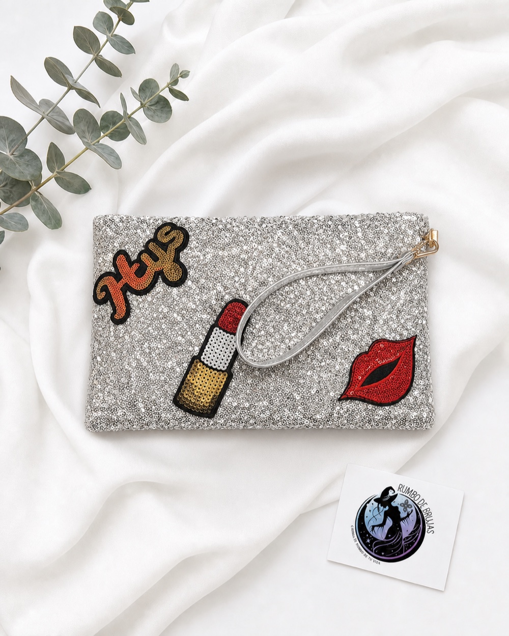Clutch plateado con labios y perfume — Rumbo de Brujas