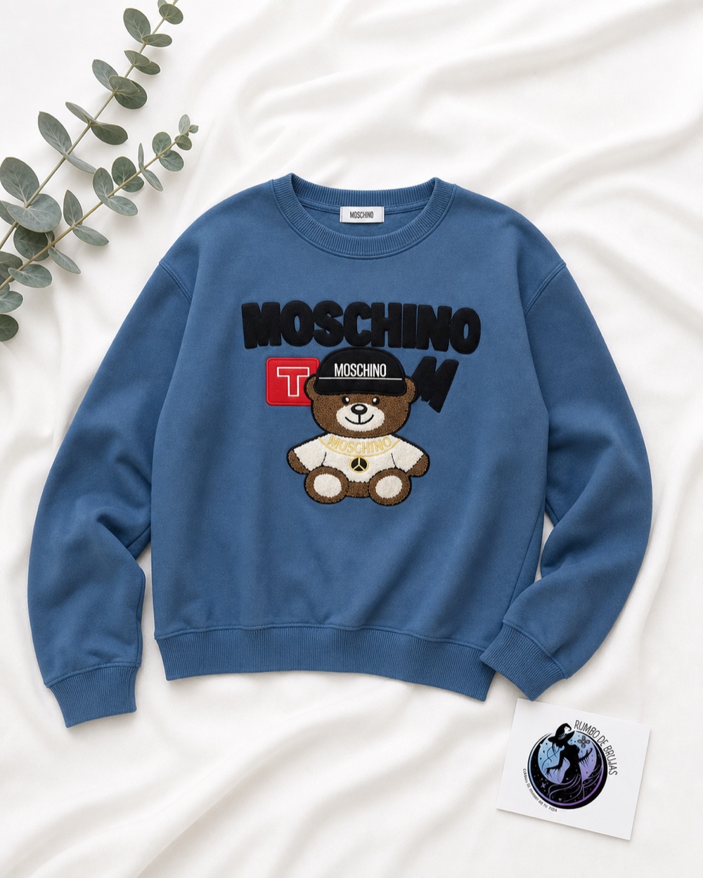 Sudadera azul con oso y logotipo Moschino — Rumbo de Brujas