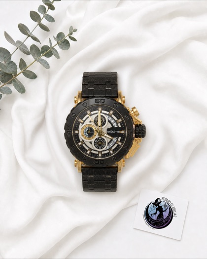 Reloj negro y dorado con gemelos — Rumbo de Brujas
